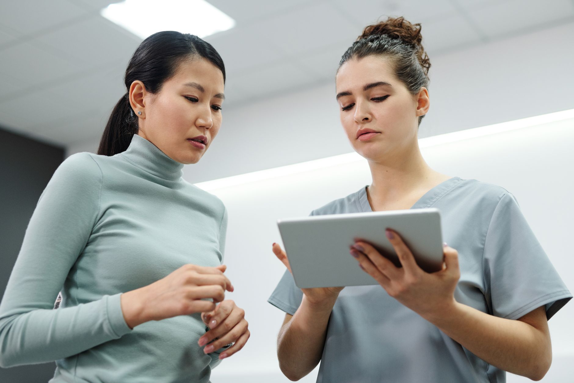 Doctor and patient discussing treatment options during a consultation in a modern clinic office