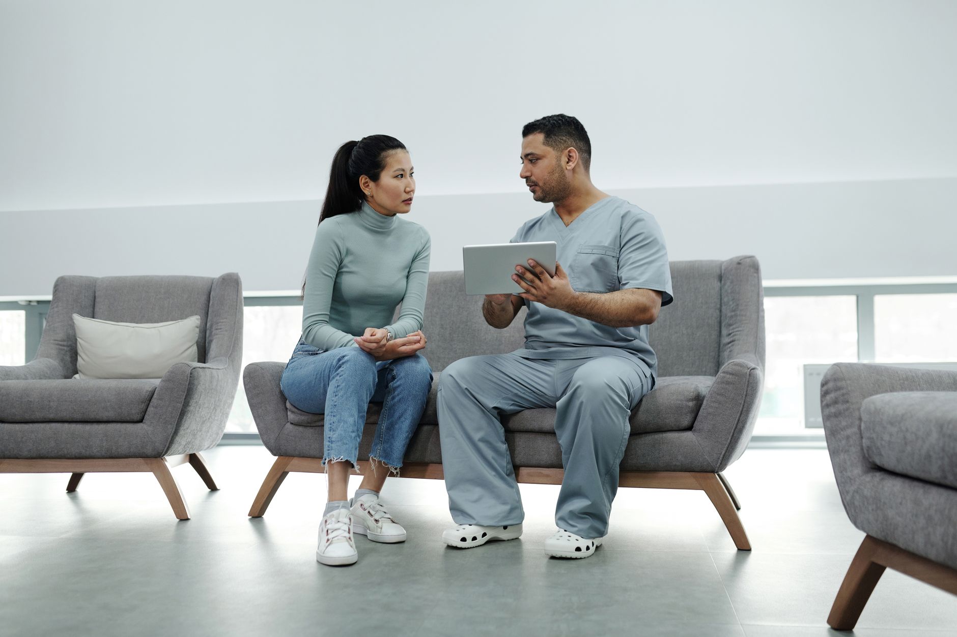 Surgeon and patient discussing a treatment plan during a consultation
