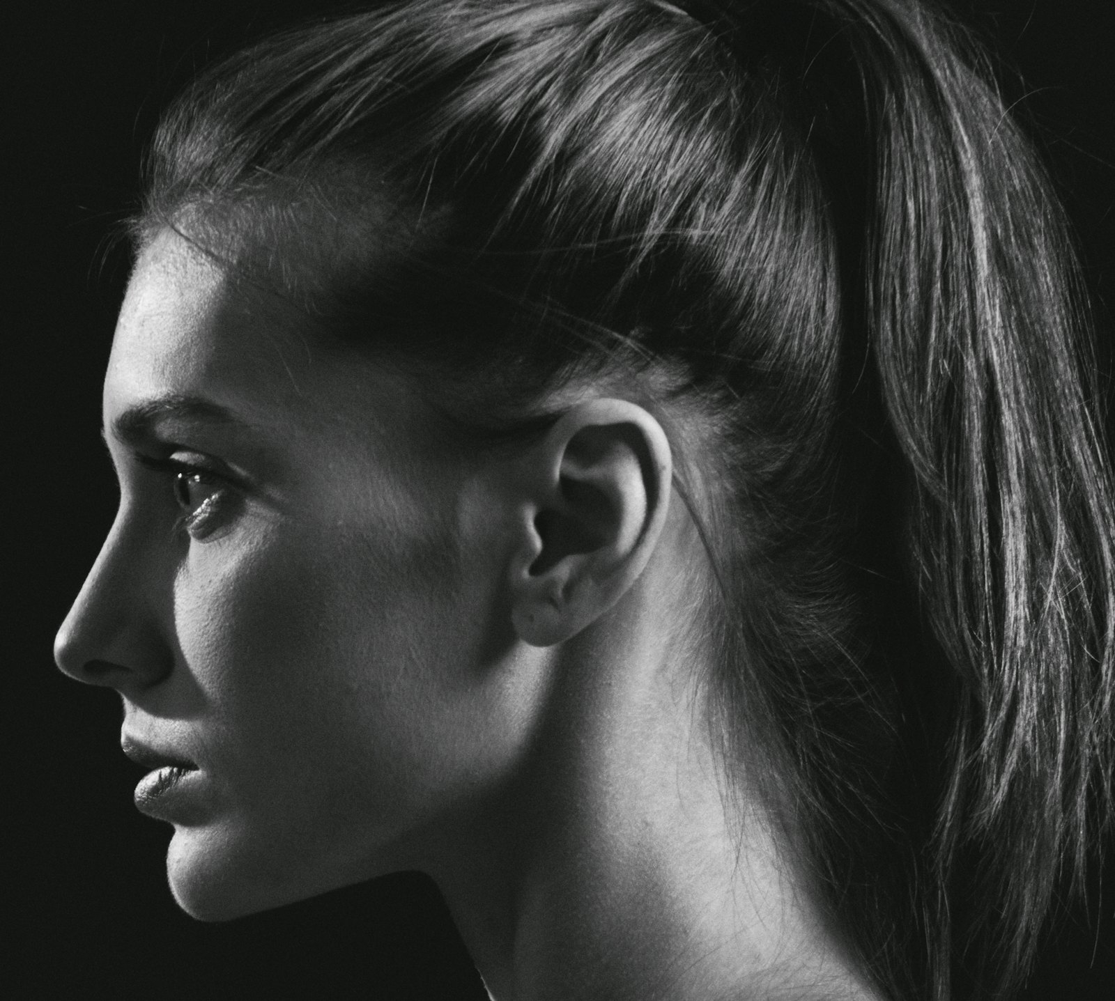 Black-and-white profile portrait emphasizing the lower-face and jaw silhouette.